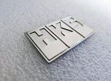 HKS titanium plaque